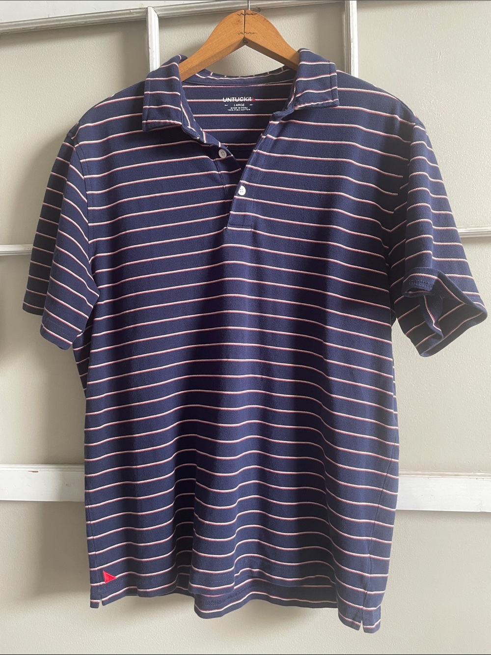 UNTUCKit Navy Polo with Coral/Pink Stripes